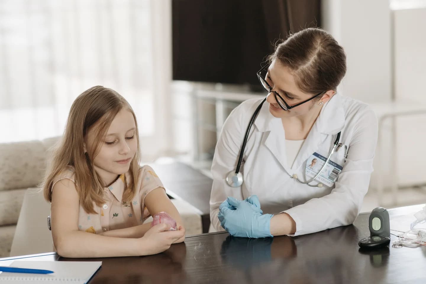 A doctor talking with a child during a checkup
