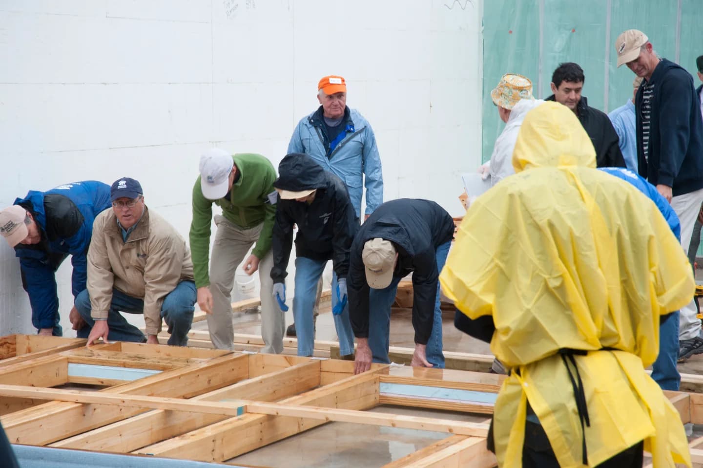 Volunteers assembling timber framing at a Washington, D.C. build in 2010
