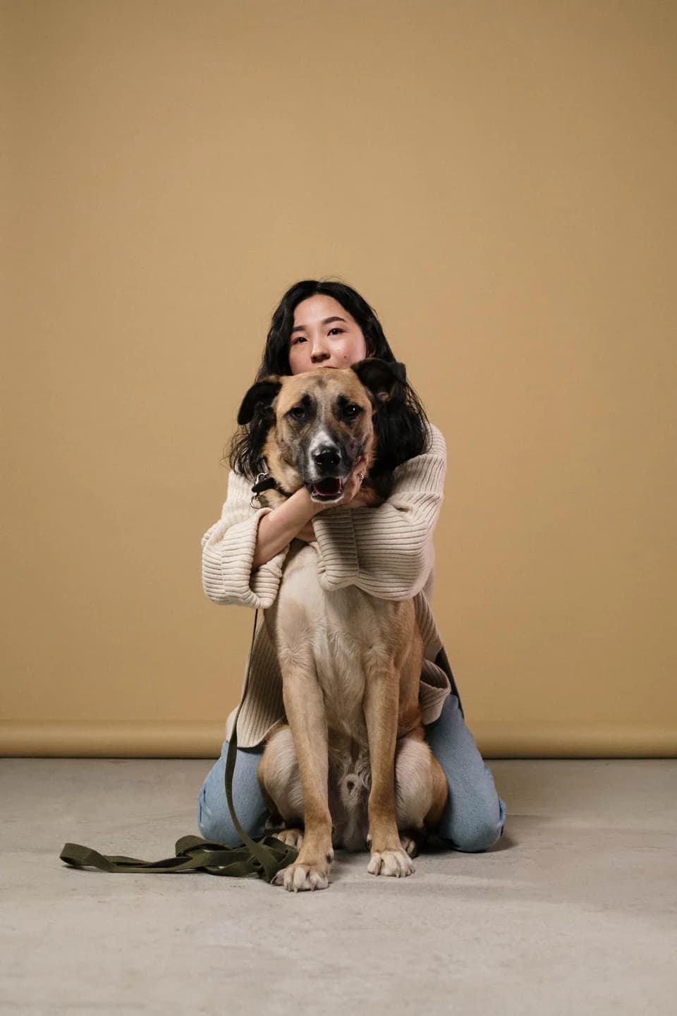 A woman embracing a dog