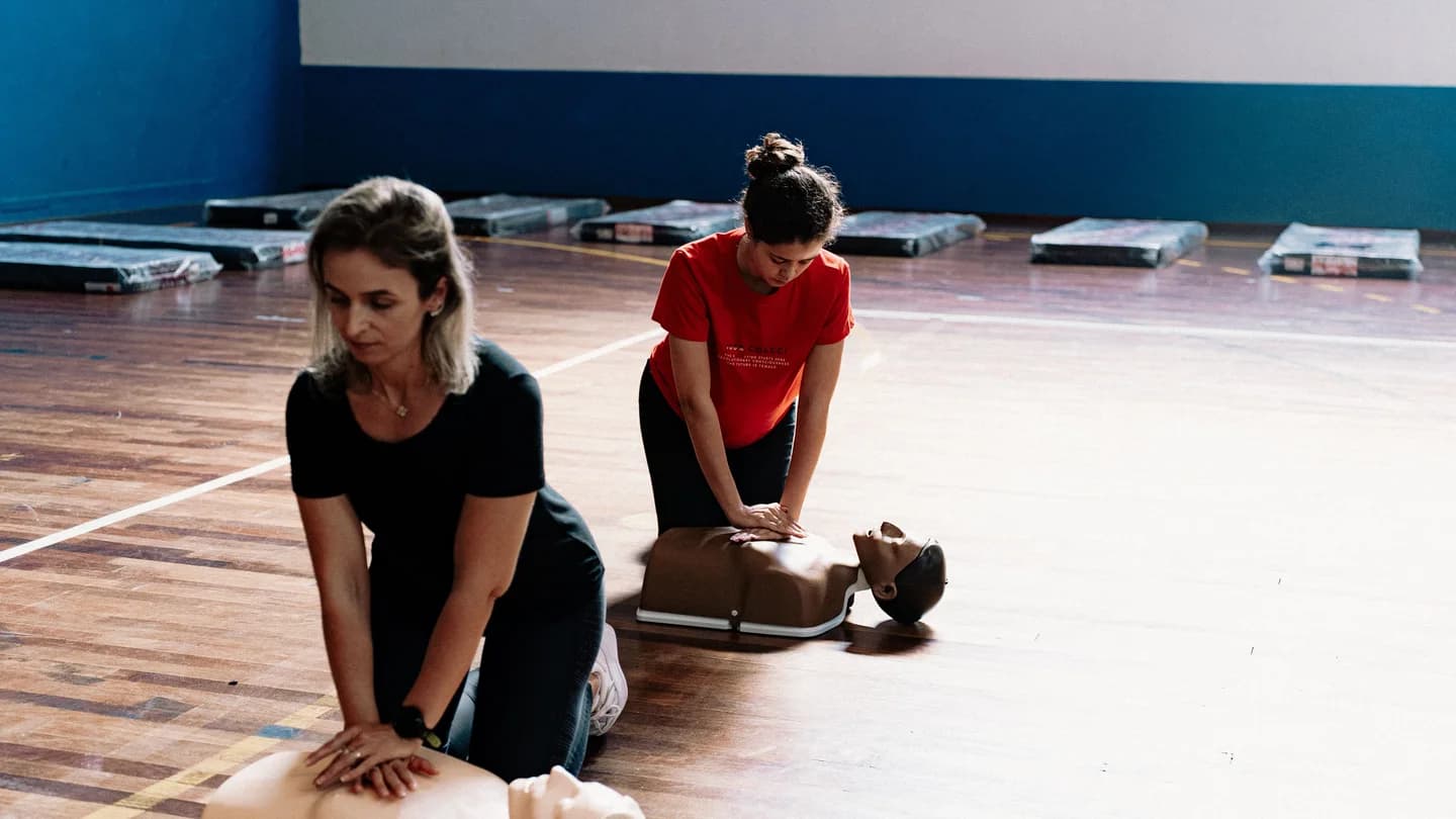 People practicing CPR on training mannequins