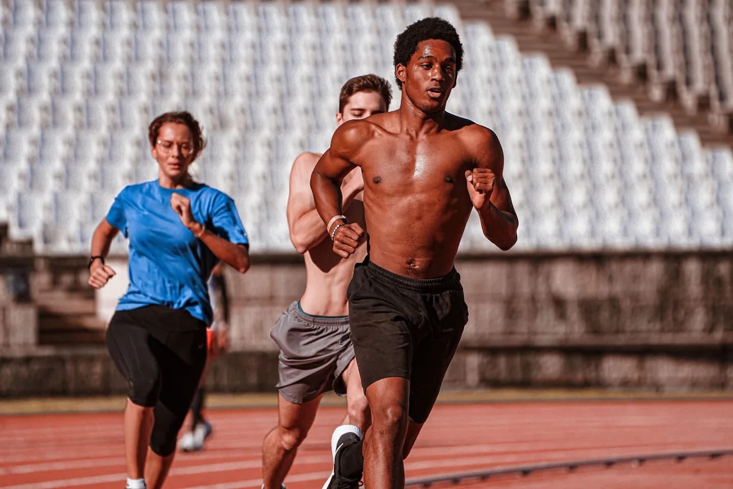 Athletes taking part in a running event on an outdoor track